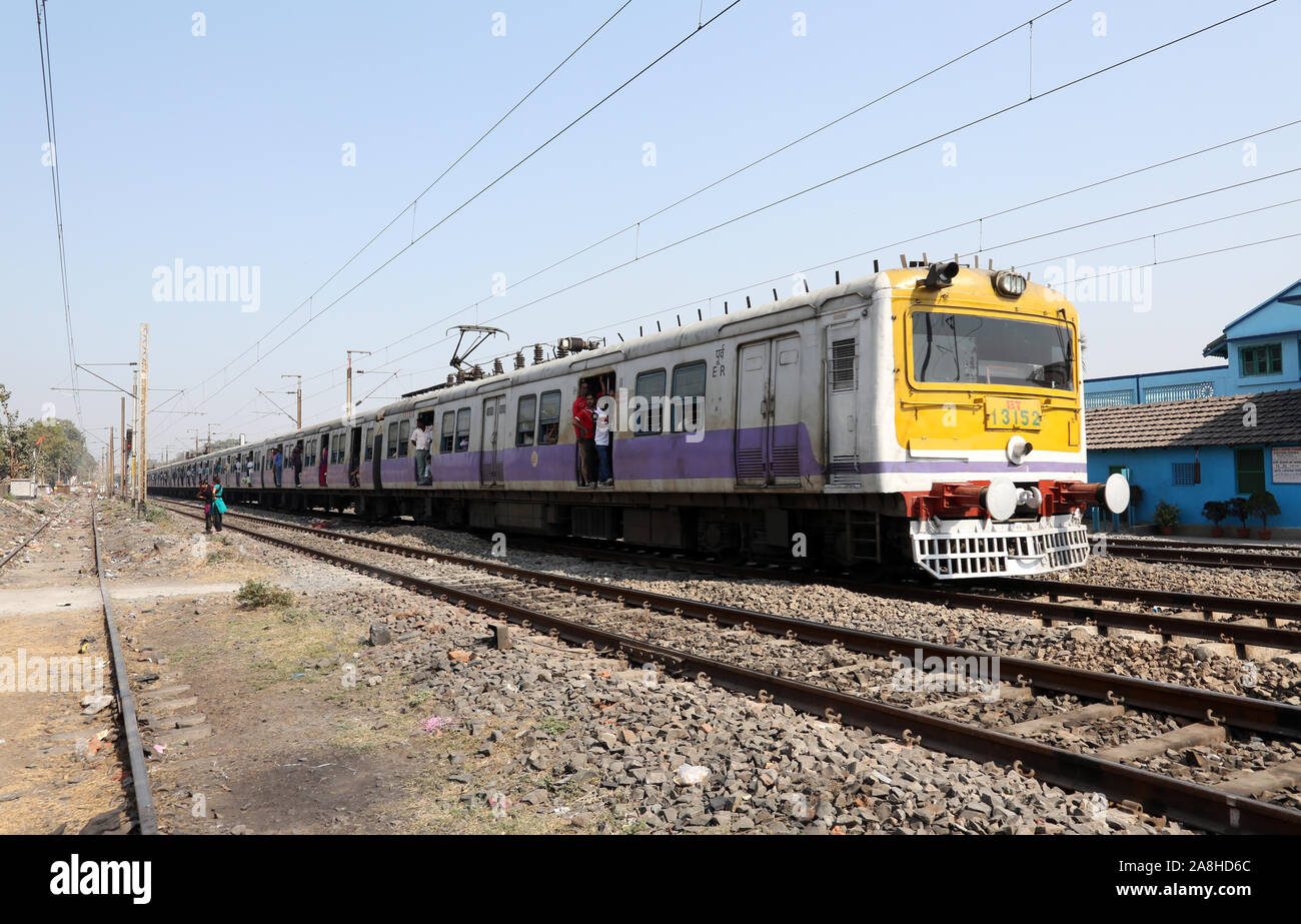 Unidentified locals and tourists commute by train in Kolkata, India Stock Photo