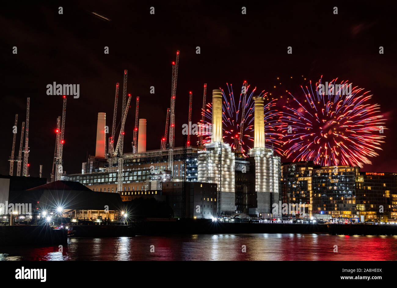 Battersea Fireworks light the sky behind and illuminated Battersea