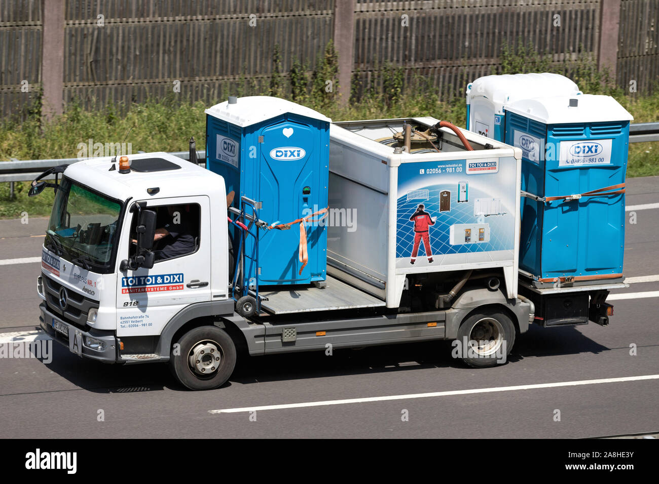TOI TOI & DIXI truck on motorway. TOI TOI & DIXI (ADCO Group) is the largest mobile sanitary solutions company, and is based in 33 countriesworldwide. Stock Photo