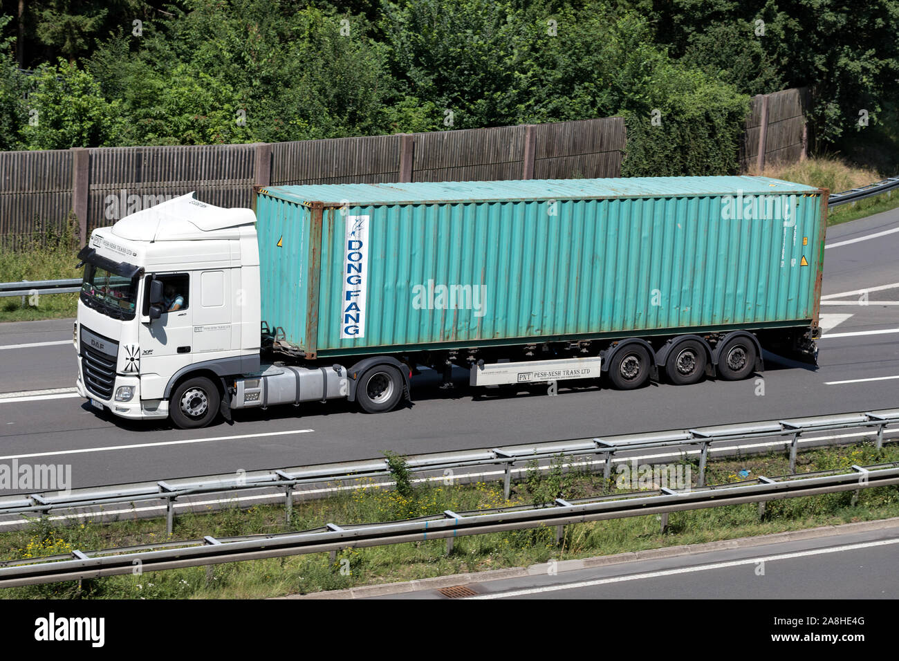 PNT Pesh-Nash Trans DAF XF truck with Dong Fang container on motorway. Stock Photo