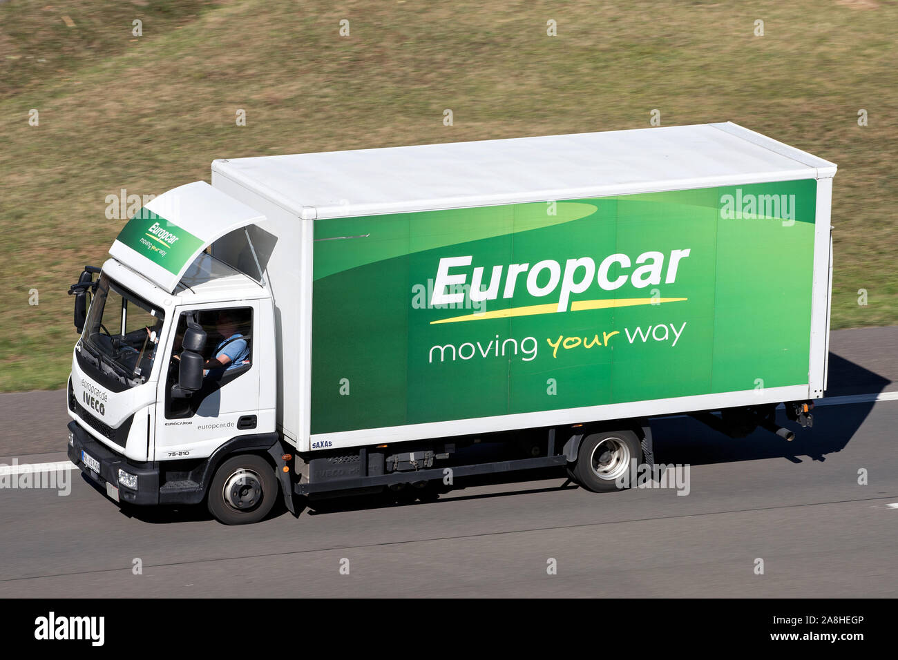 Iveco Eurocargo of Europcar on motorway. Europcar Mobility Group is a French car rental company founded in 1949 in Paris. Stock Photo