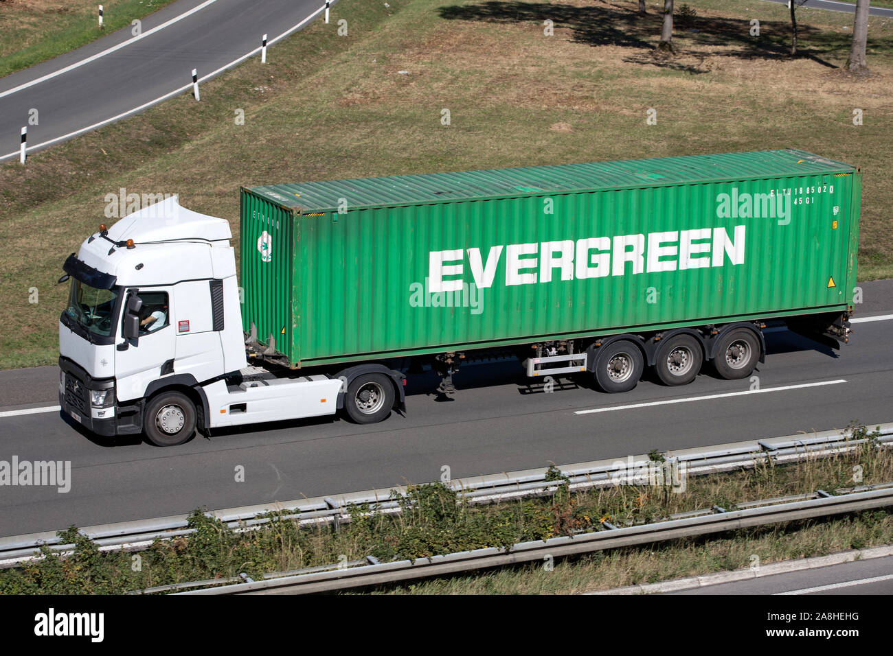 Renault truck with Evergreen container on motorway. Stock Photo