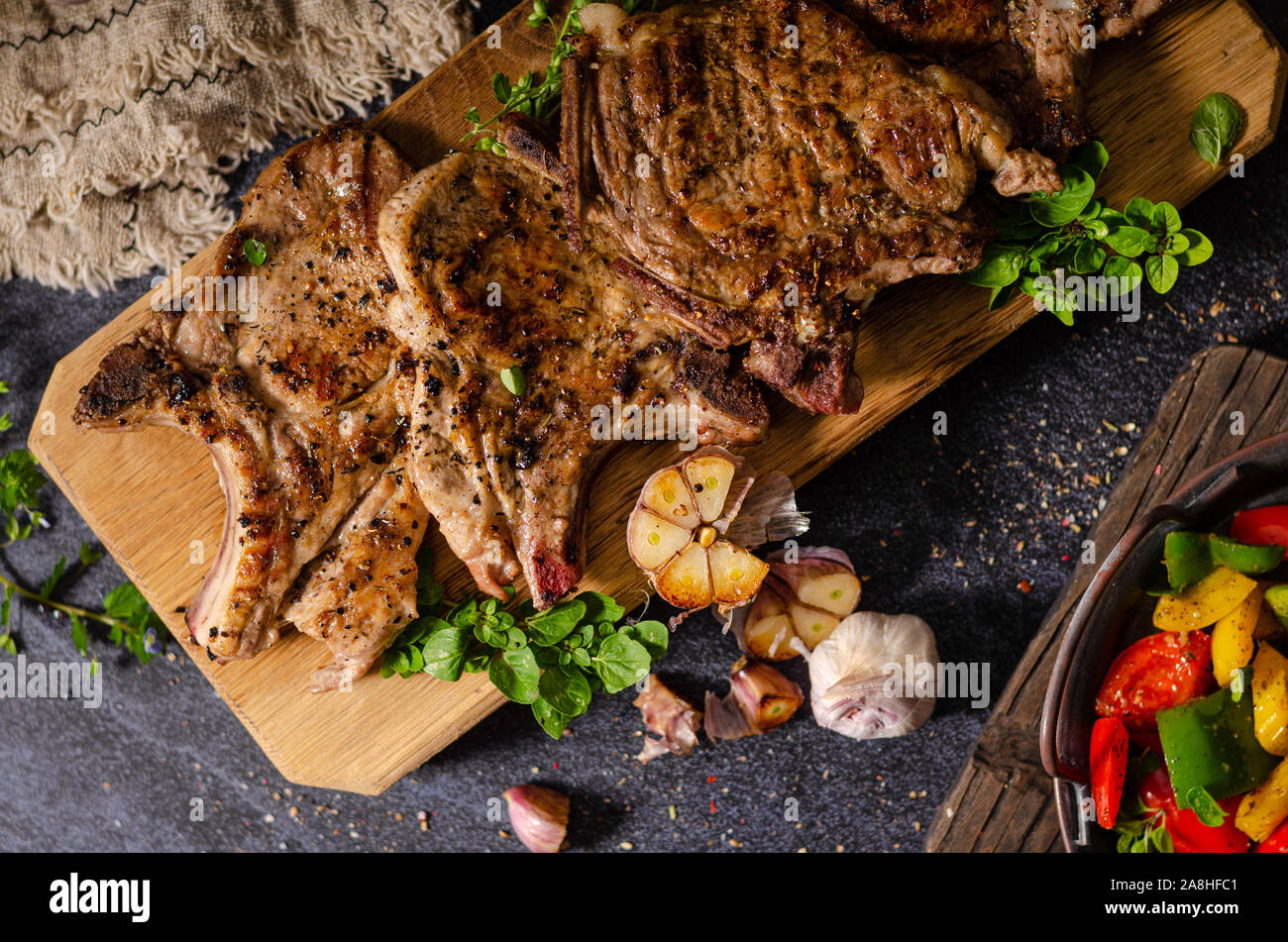Delicious grilled meat seasoned with garlic and pepper, fresh salad