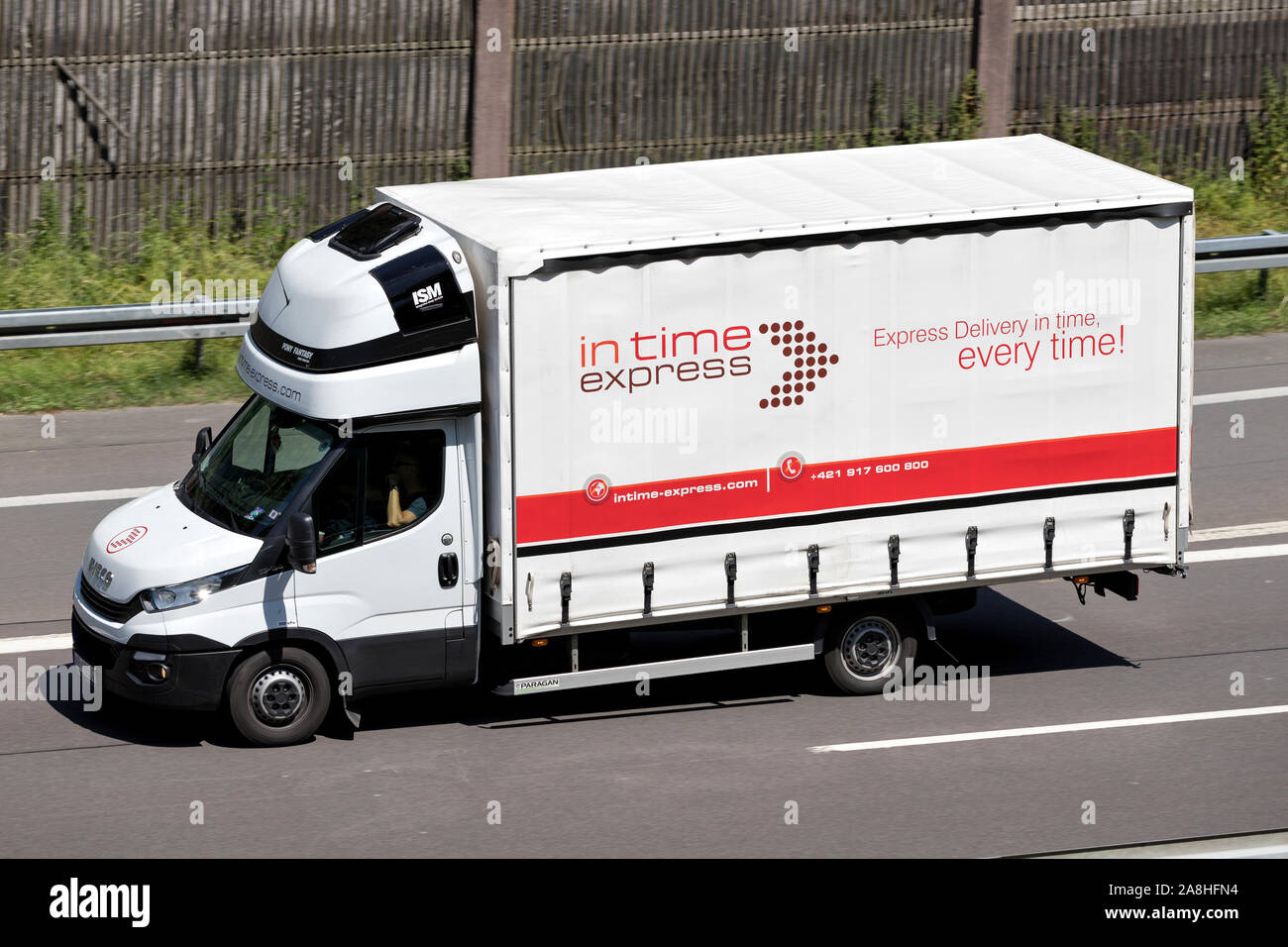 in time express Iveco Daily van on motorway. Stock Photo