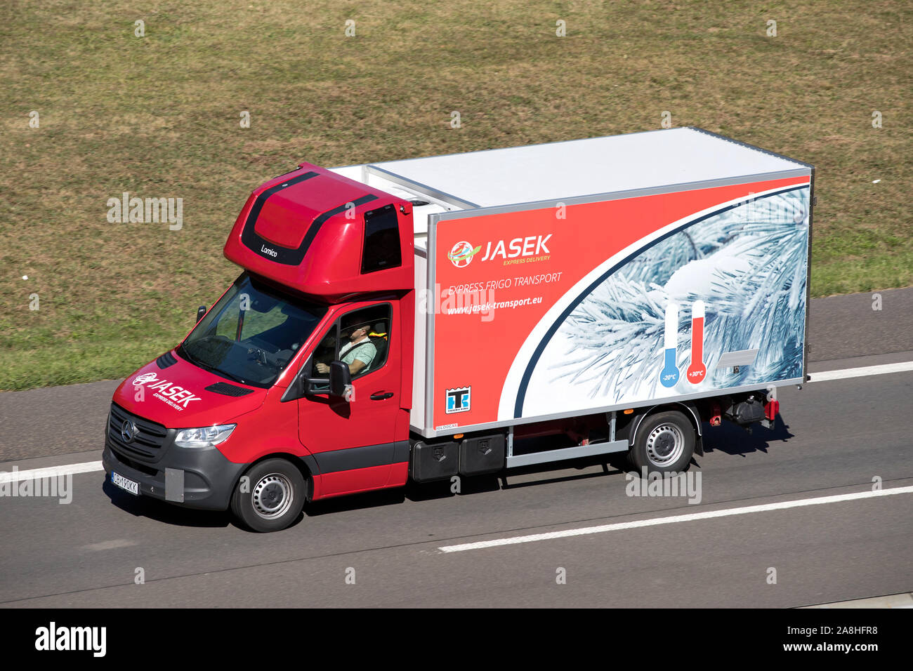Jasek temperature controlled Mercedes-Benz Sprinter van on motorway. Stock Photo
