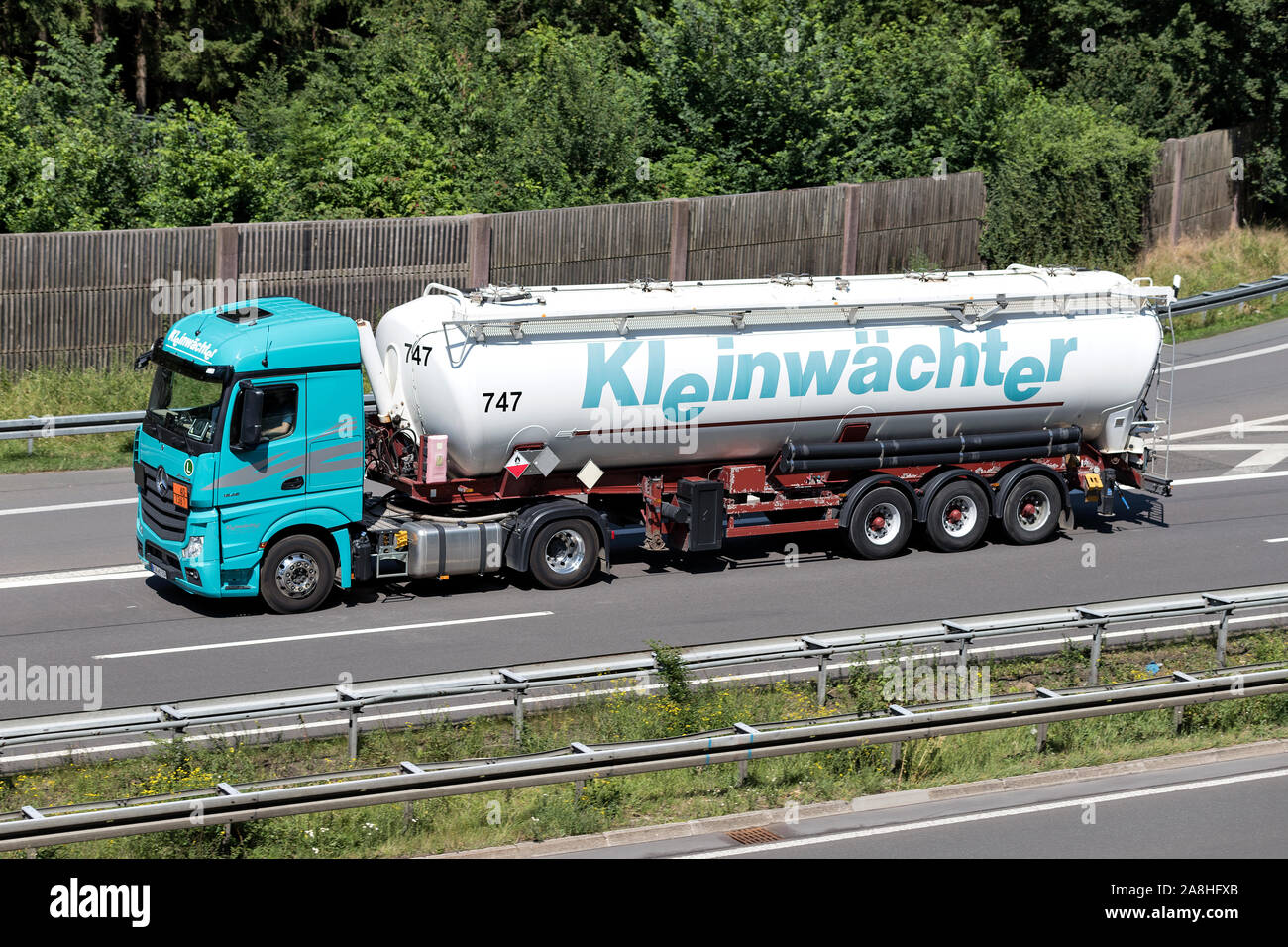 Kleinwächter Mercedes-Benz Actros truck with silo trailer on motorway. Stock Photo