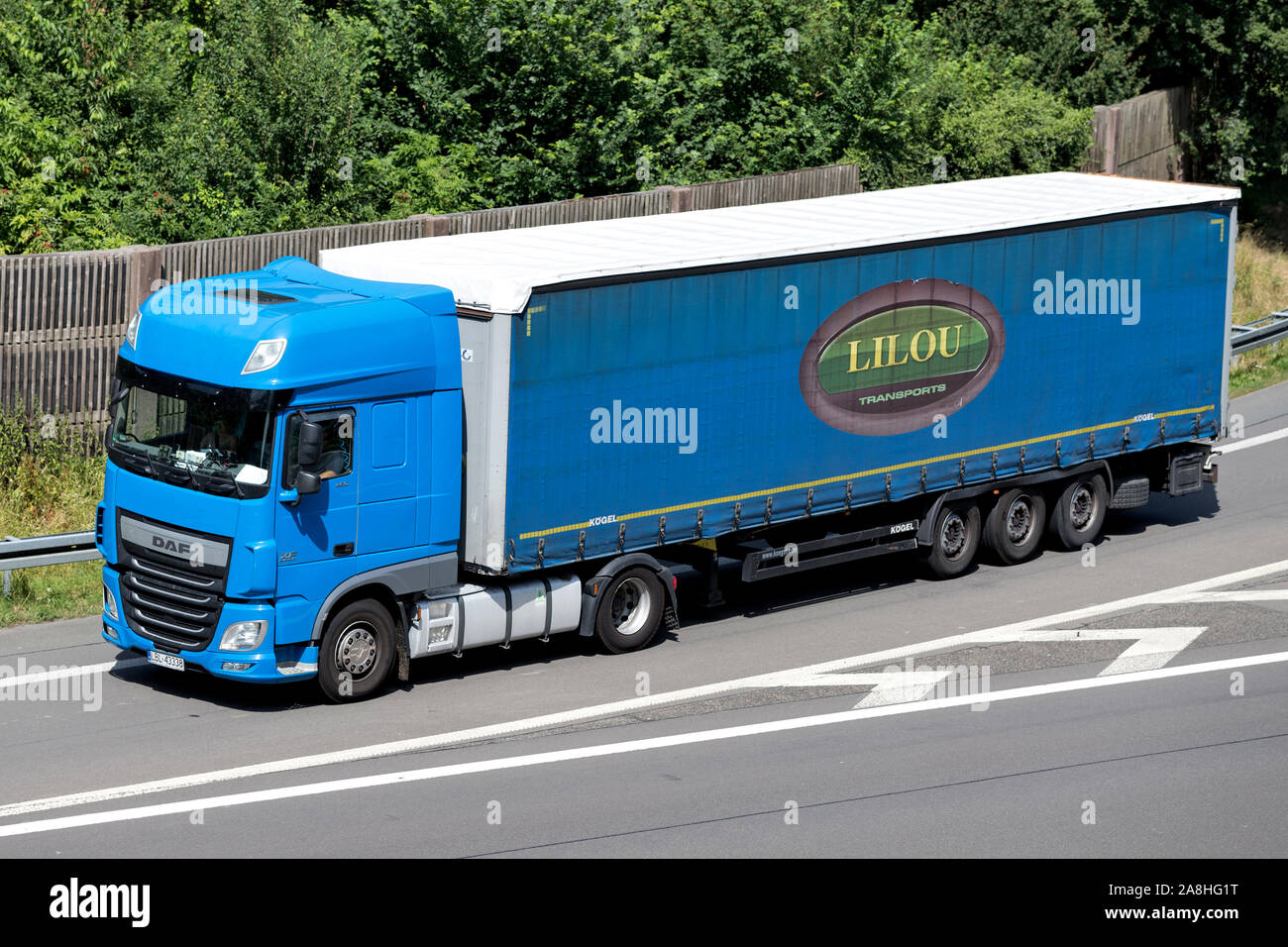 DAF XF truck with Dachser curtainside trailer on motorway Stock Photo -  Alamy