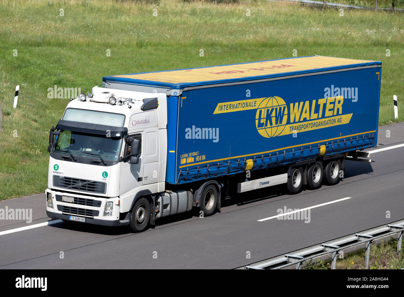 Volvo FH truck with LKW Walter curtainside trailer on motorway. Stock Photo