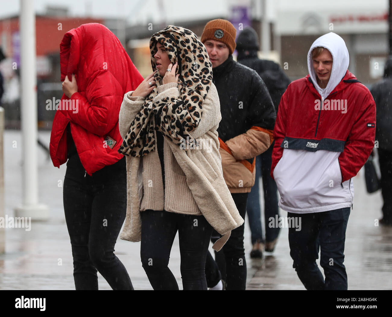 Southampton, Hampshire. UK Weather: 9th November 2019 Football fans brave the wet weather as the arrive at St Mary's Stadium ahead of the Premier League match between Southampon and Everton. Credit Stuart Martin/Alamy Live News Stock Photo