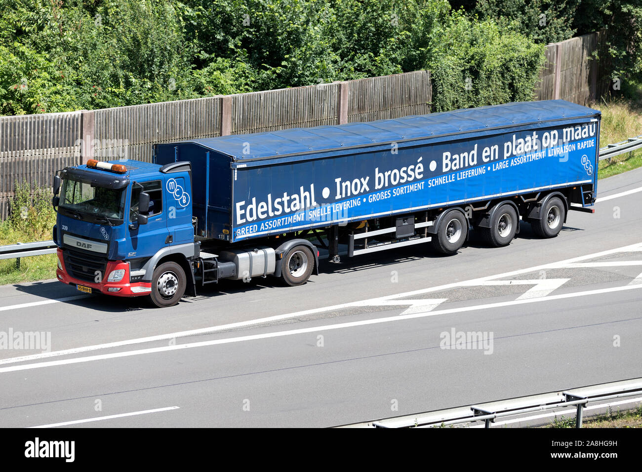 MCB DAF CF steel transporting truck on motorway. Stock Photo
