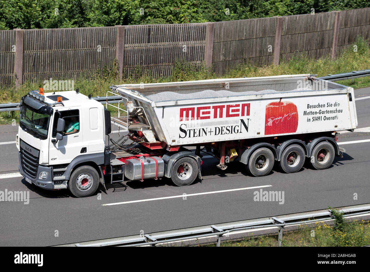 Metten DAF CF truck with tipper trailer on motorway. Stock Photo