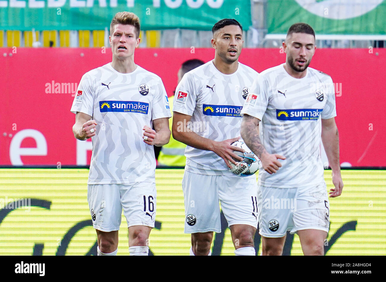 Sandhausen, Germany. 09th Nov, 2019. Soccer: 2nd Bundesliga, SV Sandhausen - SpVgg Greuther Fürth, 13th matchday, in the Hardtwaldstadion. Sandhausens goal scorer Kevin Behrens (l) cheers with Sandhausens Aziz Bouhaddouz (M) and Marlon Frey over the goal to 2:2. Credit: Uwe Anspach/dpa - IMPORTANT NOTE: In accordance with the requirements of the DFL Deutsche Fußball Liga or the DFB Deutscher Fußball-Bund, it is prohibited to use or have used photographs taken in the stadium and/or the match in the form of sequence images and/or video-like photo sequences./dpa/Alamy Live News Stock Photo