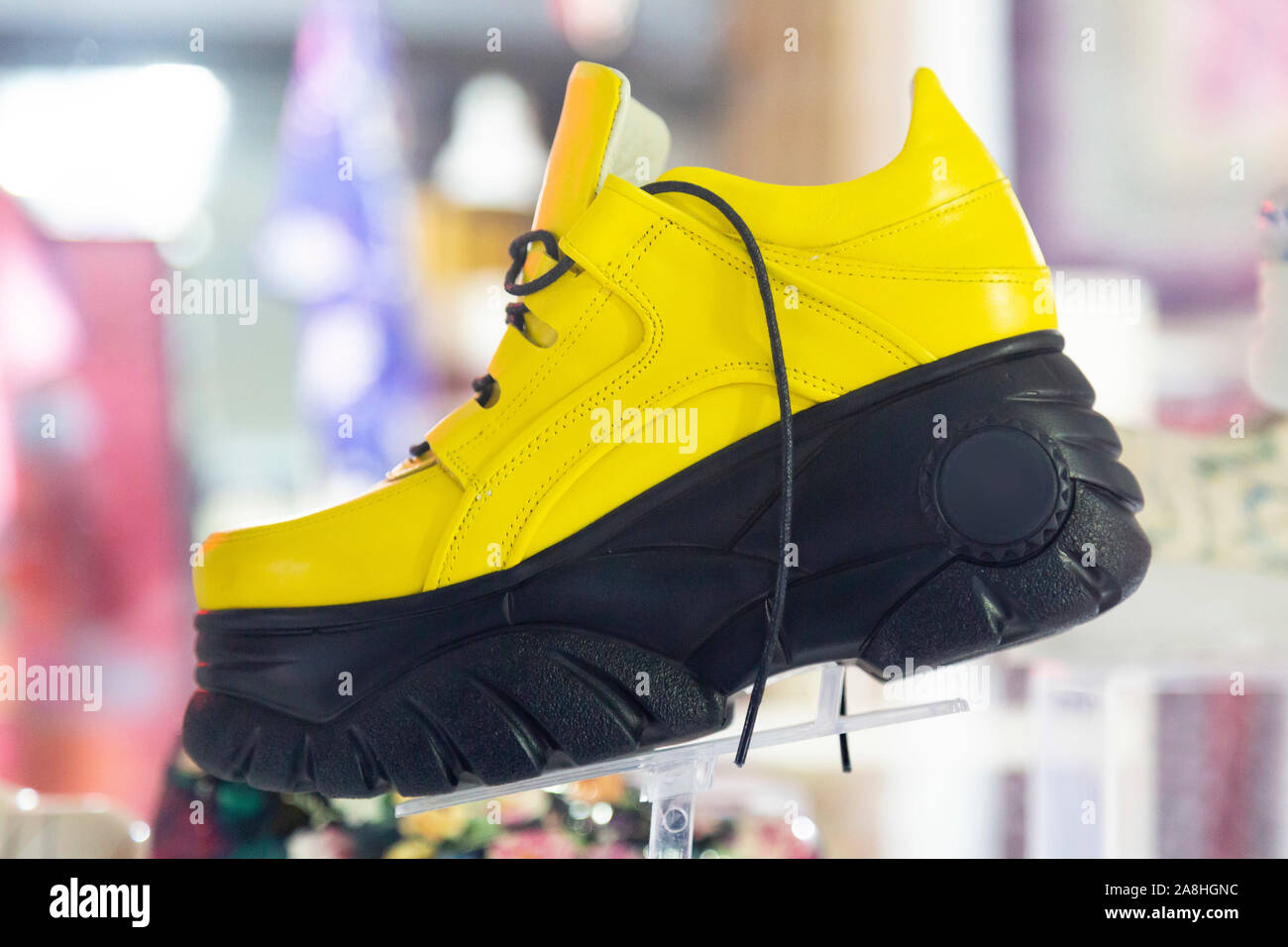 Very high big sole on yellow women's shoes Stock Photo - Alamy