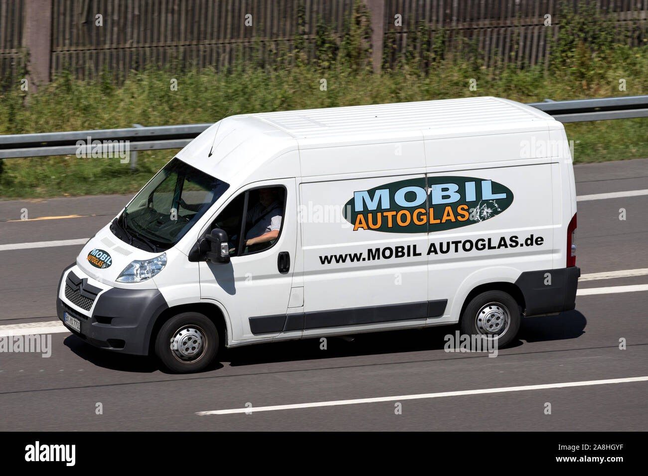 Mobil Autoglas Citroen Relay van on motorway. Stock Photo