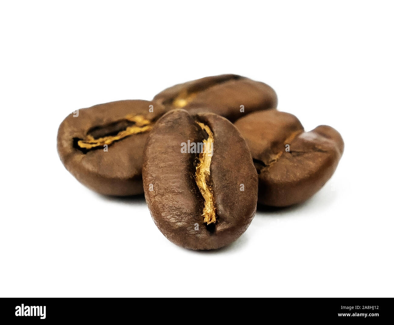 Roasted coffee beans isolated close up macro Stock Photo - Alamy