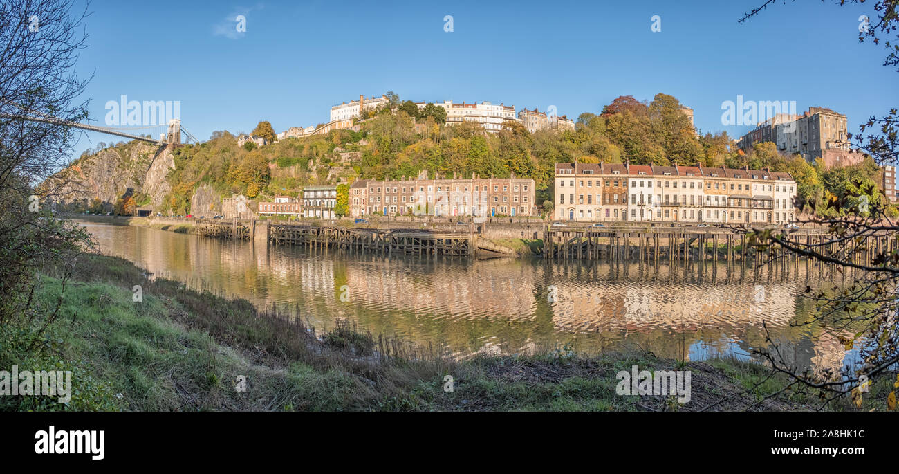 The Clifton Suspension Bridge, Wooden Wharfs, Hotwells and the Avon Gorge from the Leigh Woods side of the River Avon on a Sunny Evening, Bristol, UK Stock Photo