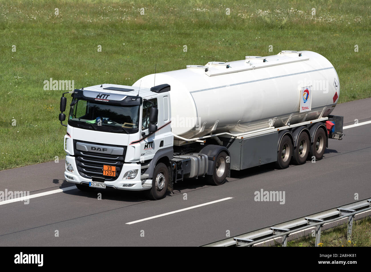 HTT DAF CF truck with Total tank trailer on motorway. Stock Photo