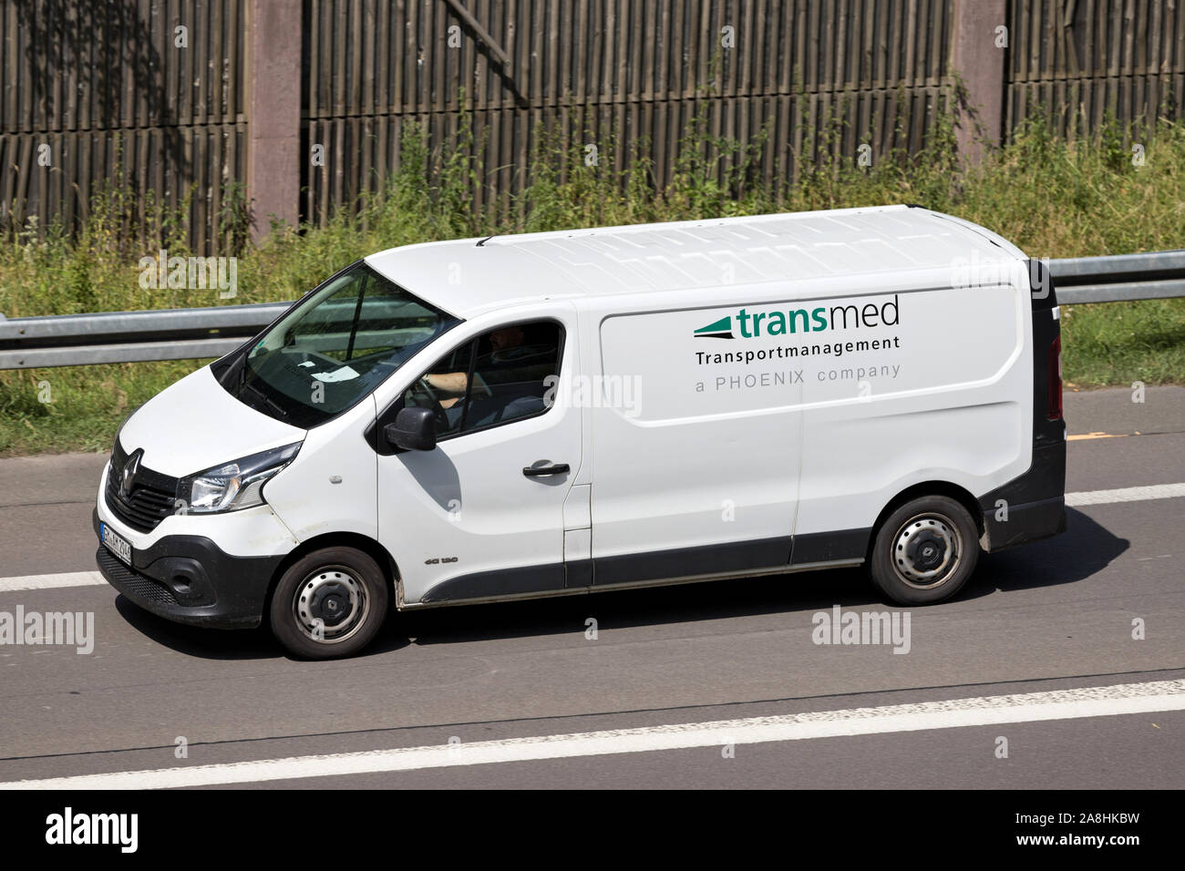 Transmed van on motorway. Transmed was foundet in 1970 and operates more than 3,000 vehicles, including 350 PharmaMobiles. Stock Photo