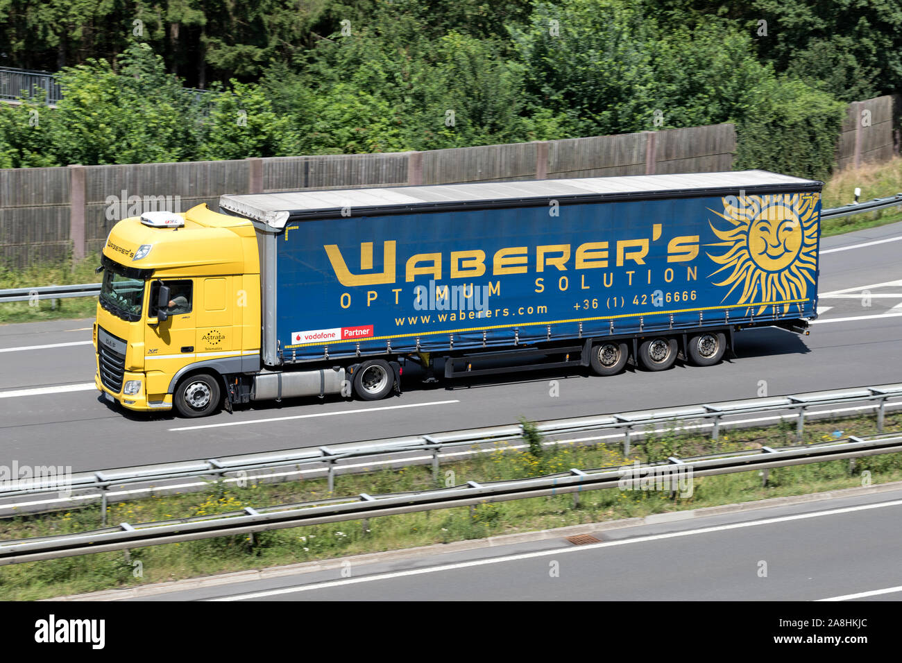 Waberer’s DAF XF truck with curtainside trailer on motorway. Stock Photo