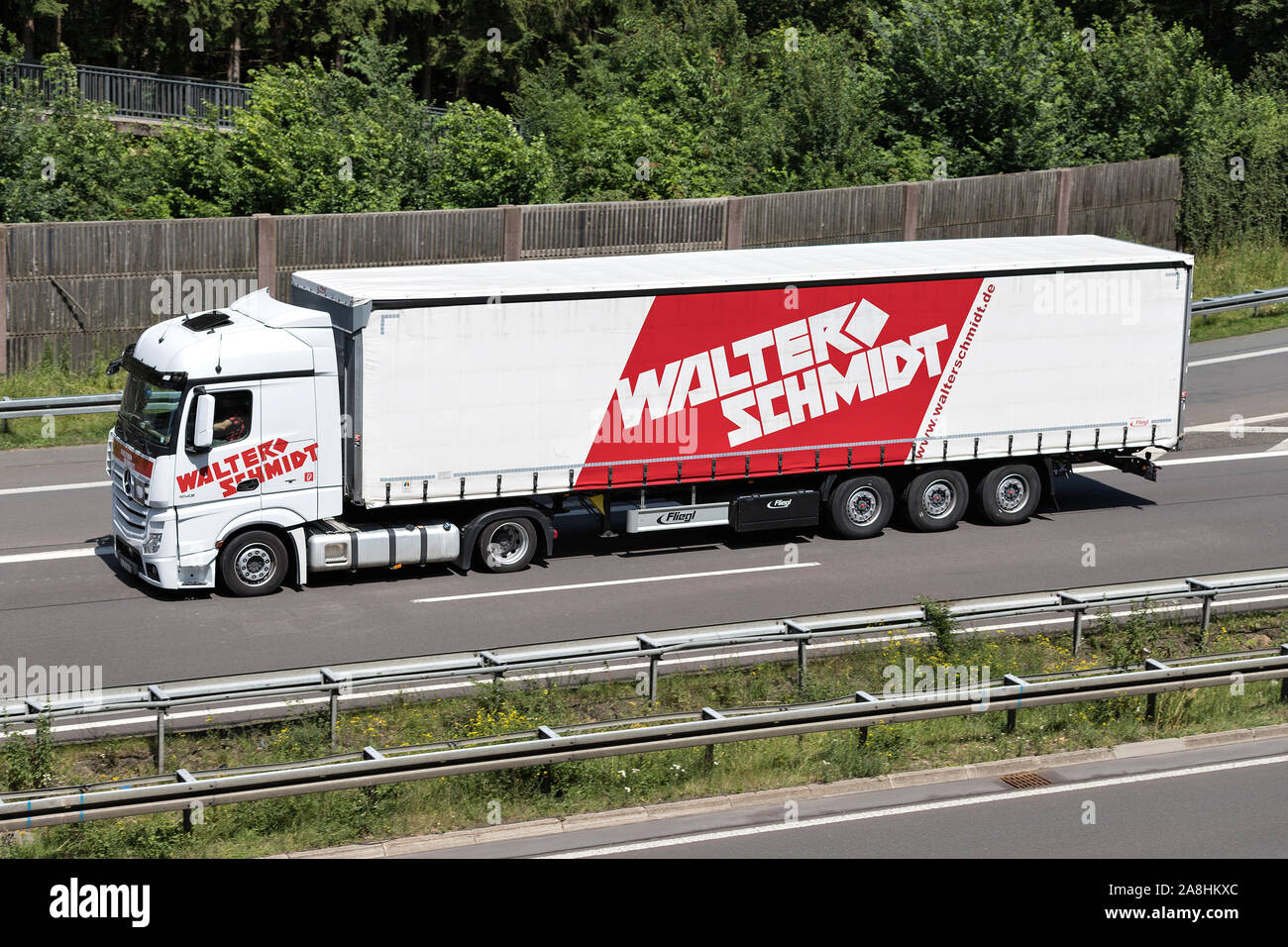 Walter Schmidt Mercedes-Benz Actros truck with curtainside trailer on motorway. Stock Photo
