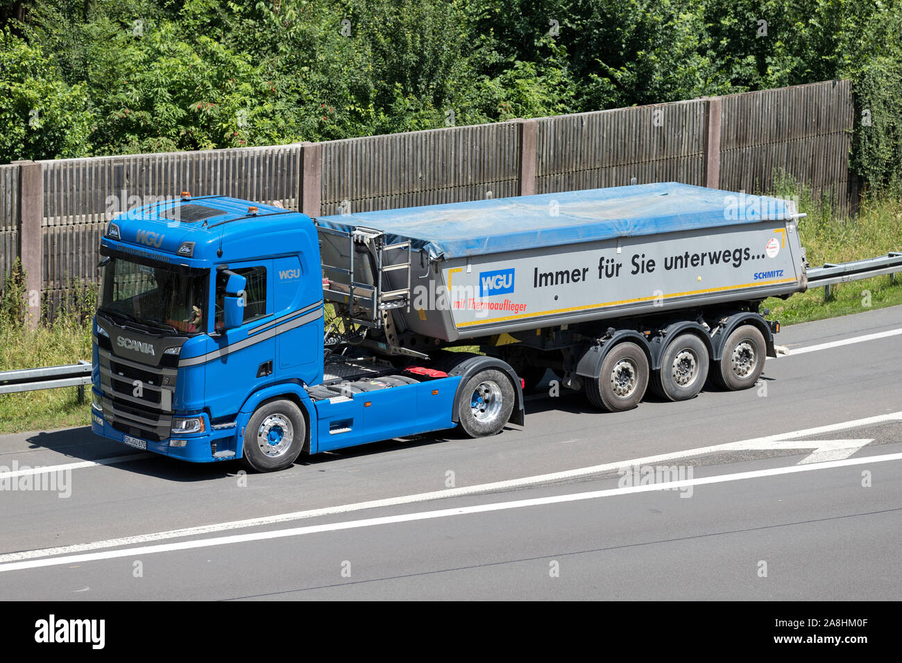 WGU Scania truck with tipper trailer on motorway. Stock Photo