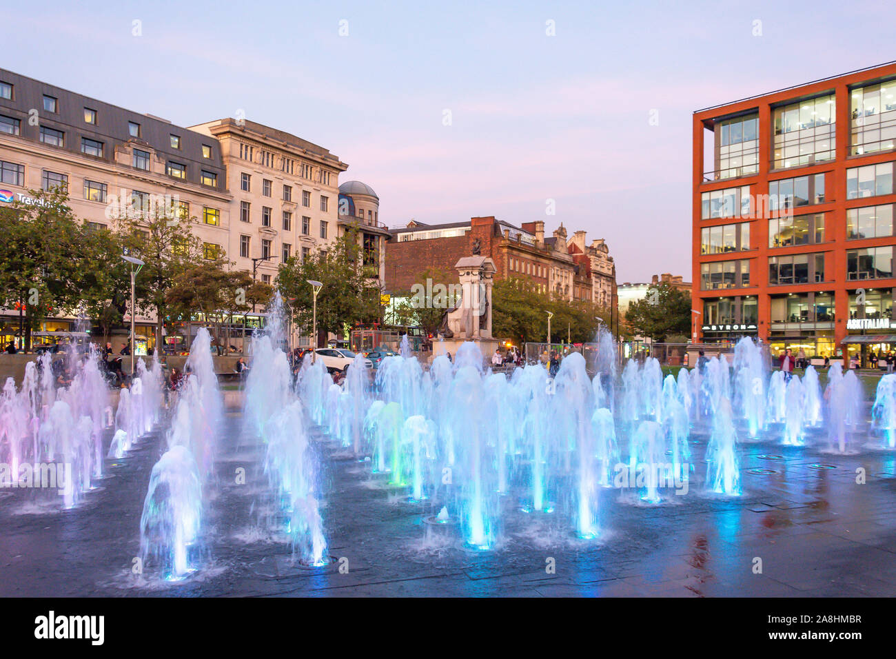 The fountain in Piccadilly Gardens at dusk, City Centre, Manchester, Greater Manchester, England, United Kingdom Stock Photo