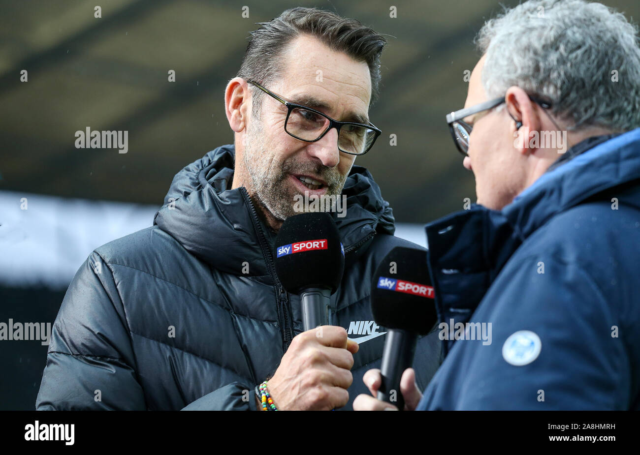 Munich, Deutschland. 09th Nov, 2019. Berlin, Germany. 09th Nov, 2019. Soccer: Bundesliga, Hertha BSC - RB Leipzig, 11th matchday, Olympiastadion Berlin. Michael Preetz (l), Managing Director of Hertha BSC, speaks in an interview. Credit: Andreas Gora/dpa - IMPORTANT NOTE: In accordance with the requirements of the DFL Deutsche Fußball Liga or the DFB Deutscher Fußball-Bund, it is prohibited to use or have used photographs taken in the stadium and/or the match in the form of sequence images and/or video-like photo sequences./dpa/Alamy Live News Stock Photo