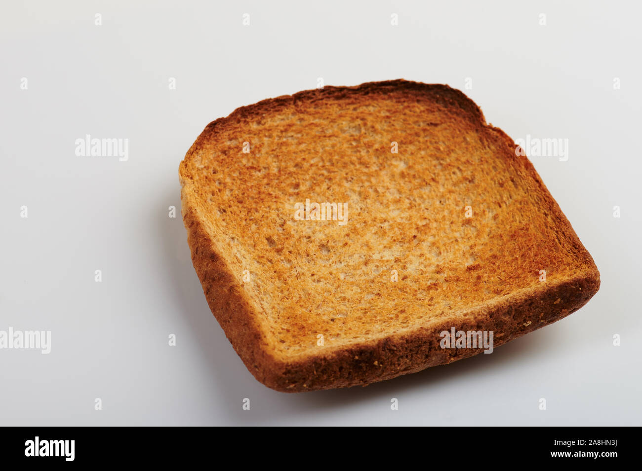 Brown bread toast angle view isolated on white background Stock Photo