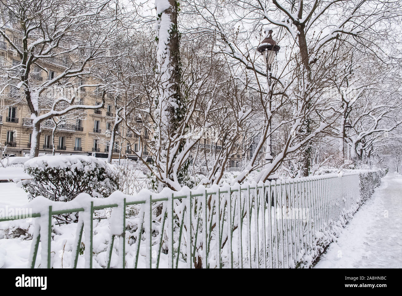 Paris under the snow, typical facades on the boulevard Richard-Lenoir Stock Photo