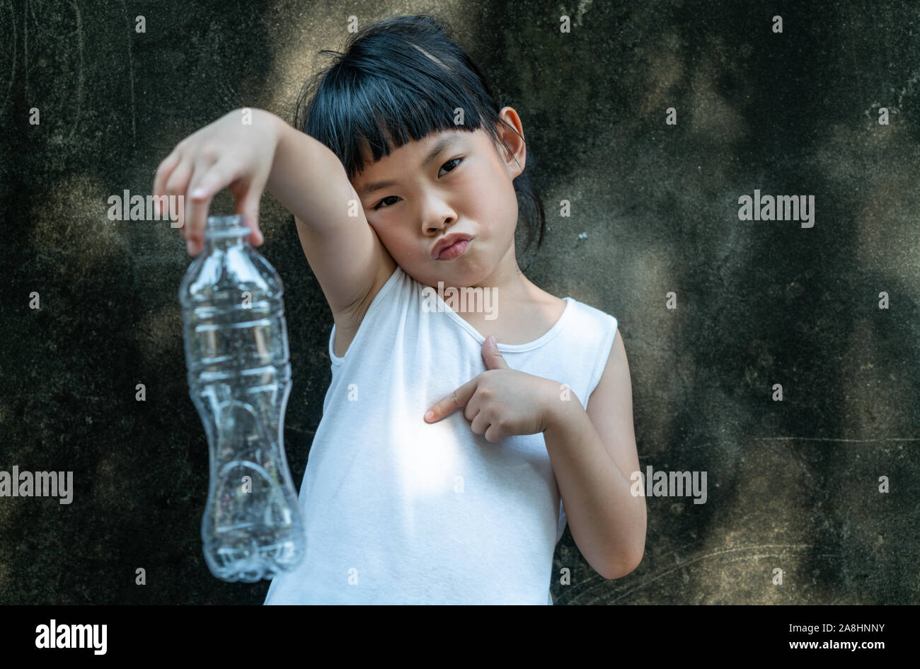 Child Girl Is Holding With Plastic Bottle Concept For Stop Using