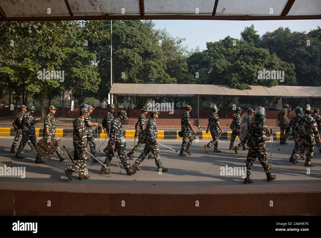 New Delhi. 9th Nov, 2019. Indian paramilitary troopers march outside the Supreme Court in New Delhi, Nov. 9, 2019. In a landmark judgment, the Supreme Court of India decided on Saturday to give a disputed land in northern state of Uttar Pradesh's Ayodhya district to the Hindus represented by the 'Janambhoomi Nyas.' The Muslims, represented by the 'Sunni Waqf Board,' would get a piece of land measuring 5 acres at some other place within Ayodhya, said the apex court's verdict. Credit: Javed Dar/Xinhua/Alamy Live News Stock Photo