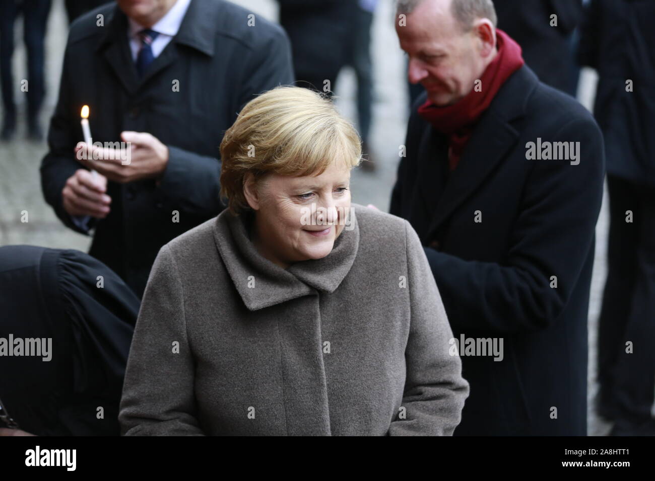 11/09/2019, Berlin, Germany, Chancellor Angela Merkel,  lighting candles at the memorial to commemorate the divided city and the victims of communist tyranny. Stock Photo