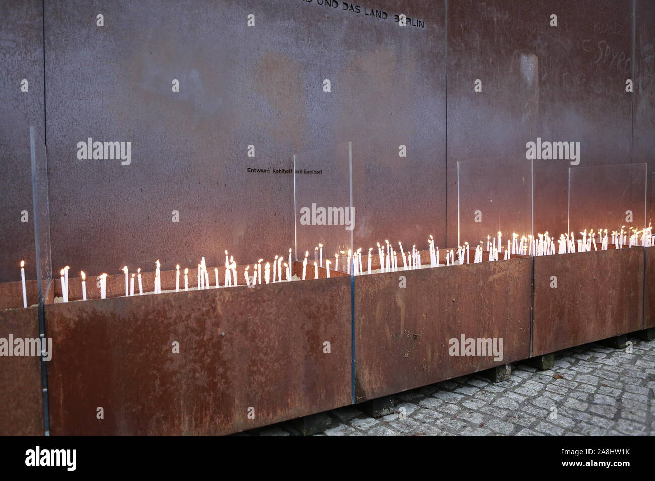 11/09/2019, Berlin, Germany, lighting candles at the memorial to commemorate the divided city and the victims of communist tyranny. Stock Photo