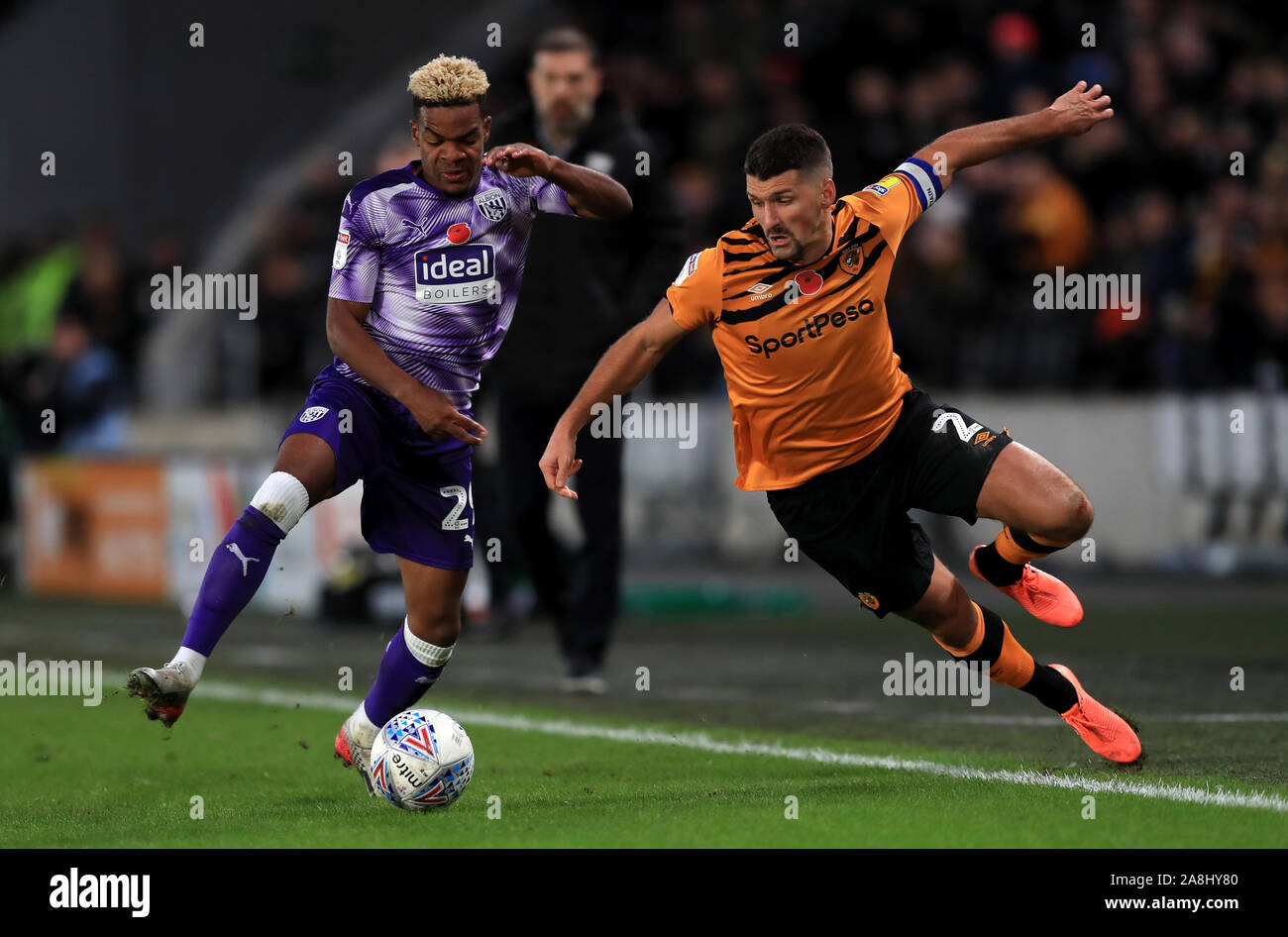 West Bromwich Albion's Grady Diangana (left) and Hull City's Eric Lichaj battle for the ball during the Sky Bet Championship match at the KCOM Stadium, Hull. Stock Photo