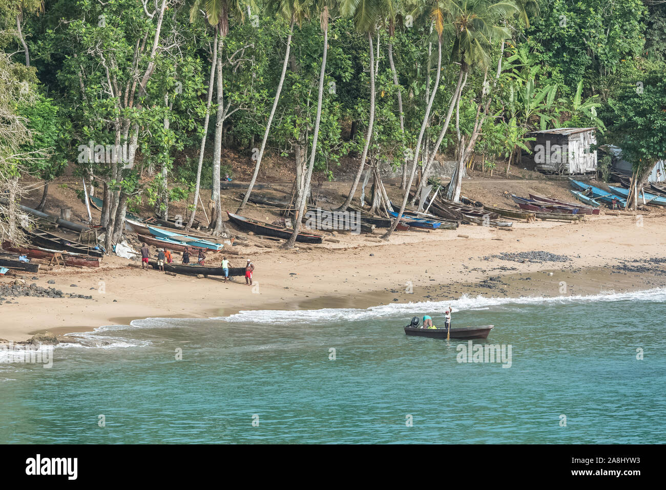 Sao Tome, dugouts on the beach in fishermen's village, typical houses Stock Photo