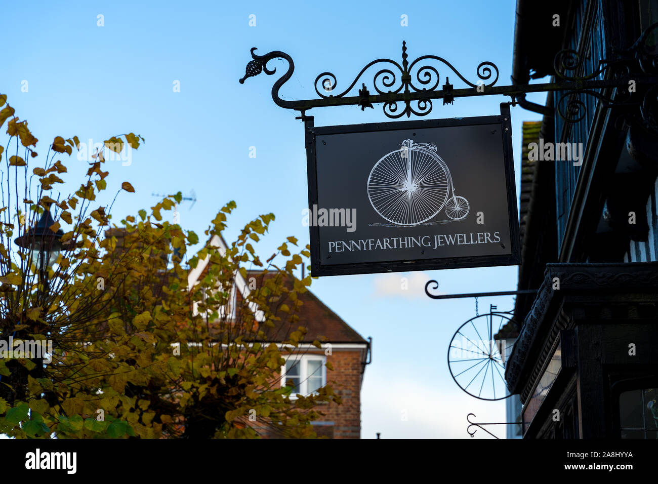 EAST GRINSTEAD, WEST SUSSEX/UK - NOVEMBER 7 : Hanging sign for Penny Farthing jewellers in East Grinstead West Sussex on November 7, 2019 Stock Photo