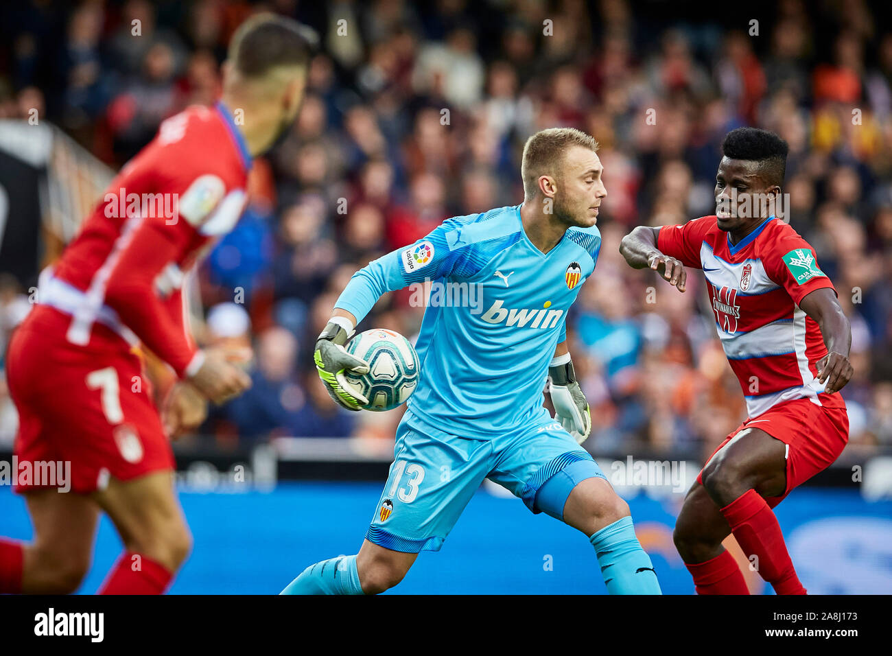 Mestalla, Valencia, Spain. Mestalla, Valencia, Spain. 9th November 2019; ; La Liga Football, Valencia versus Granada; Goal Keeper Cillessen is challenged by Alvaro Vadillo of Granada and Ramon Azeez of Granada as he tries to start a quick break - Editorial Use Credit: Action Plus Sports Images/Alamy Live News Stock Photo