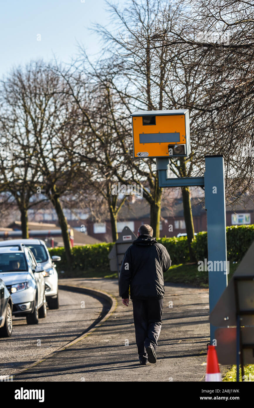 Cars travel past a speed camera in Stoke on Trent, slowing down as they pass the camera, safe driving Stock Photo