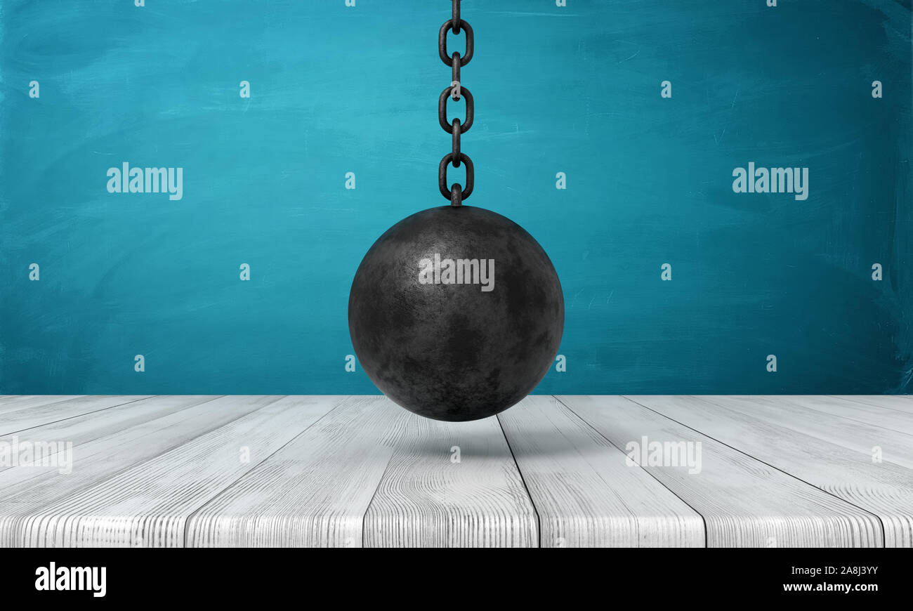 3d rendering of black wrecking ball hanging above wooden surface. Stock Photo