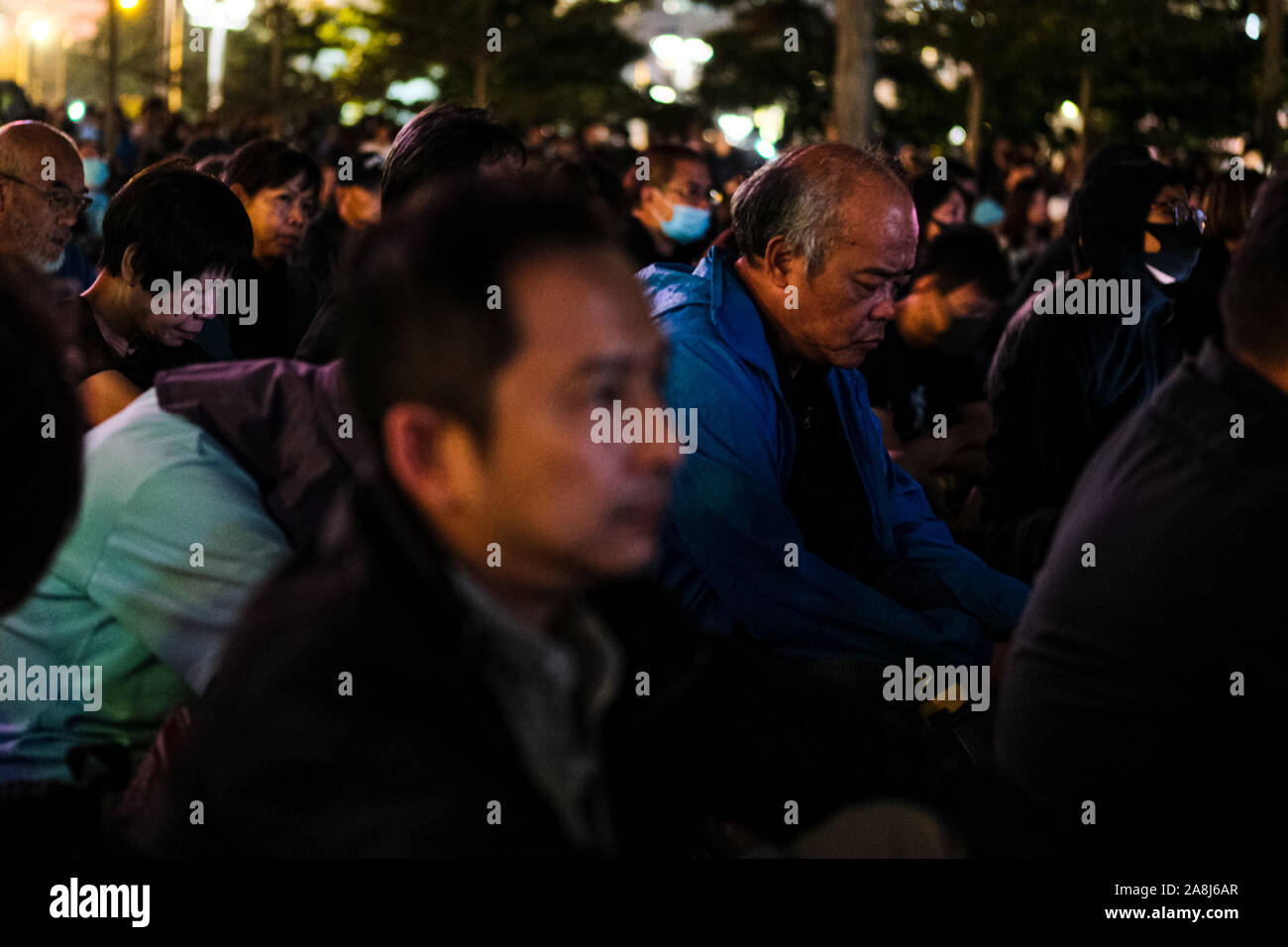 Hong Kong, China. 9th Nov, 2019. Tens of thousands of Hong Kongers participate during a memorial rally at Tamar Park in Hong Kong to mourn the death of a 22 years old university student Alex Chow Tsz Lok, who died from a serious brain injury during a fall on November 4th as police skirmished with demonstrators last weekend. He was left in critical condition and died after suffering a cardiac arrest on Friday. Credit: Keith Tsuji/ZUMA Wire/Alamy Live News Stock Photo