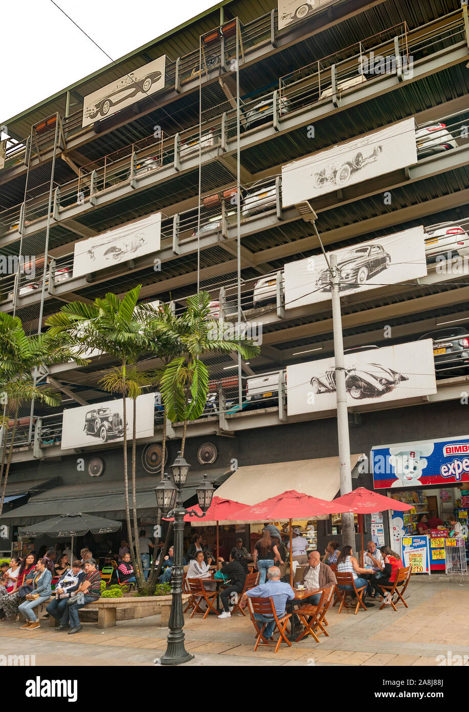 Car park building and street cafe in Envigado, Medellin, Colombia. Stock Photo