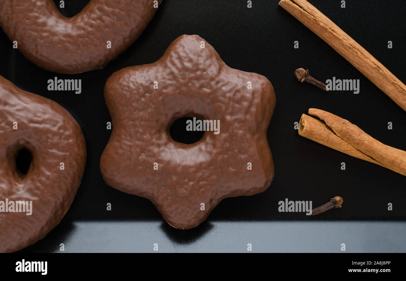 traditional german christmas chocolate gingerbread lebkuchen with cinnamon sticks and clove Stock Photo
