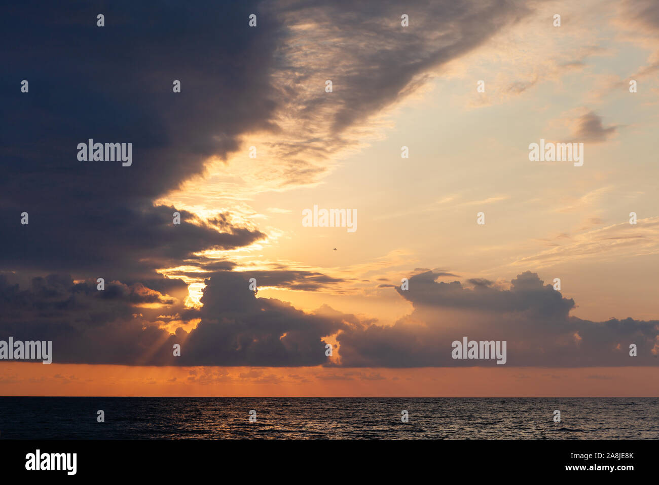 Beautiful sunset seascape with dark clouds Stock Photo