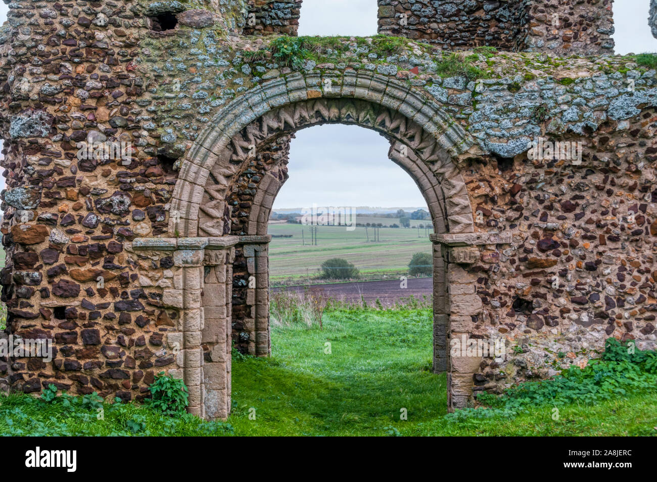 A Norman arch in the central tower of the ruined church of St Mary or St James at Bawsey, near King's Lynn, Norfolk. Known locally as Bawsey Ruins. Stock Photo