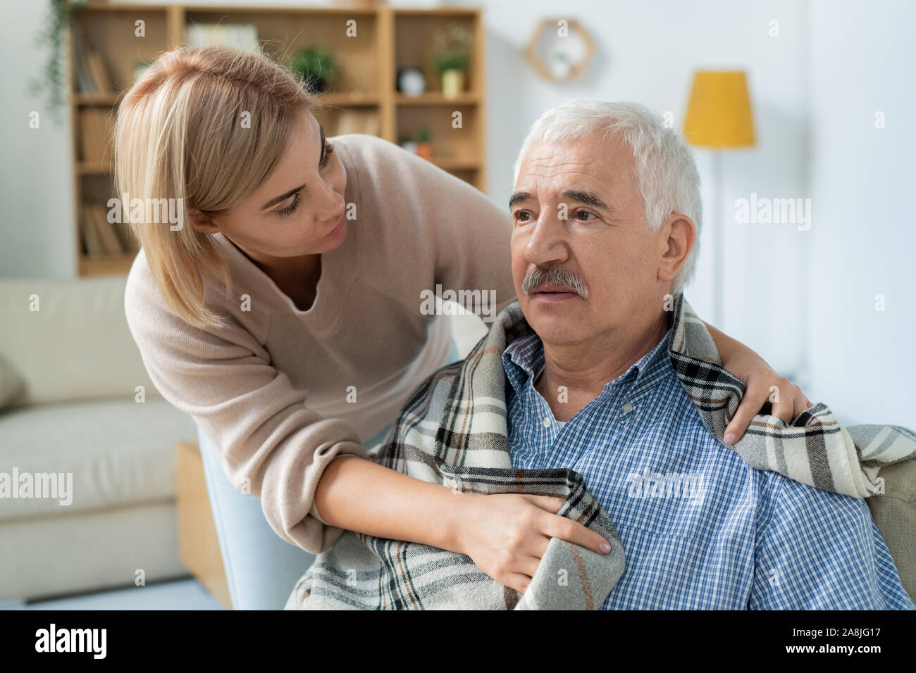 Careful and affectionate daughter taking care of her sick senior father at home Stock Photo - Alamy