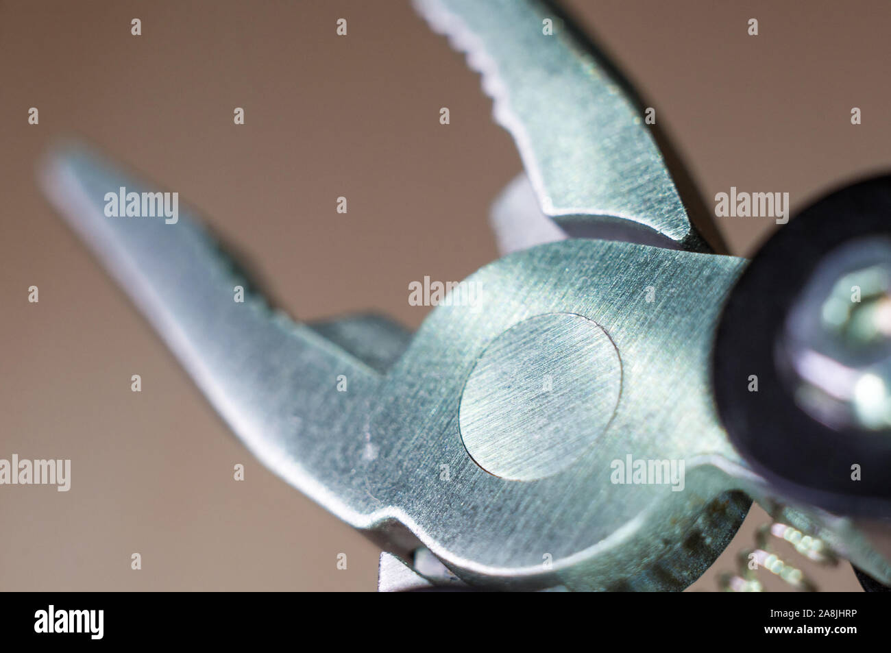 elements small foldable steel multitool, closeup, macro Stock Photo
