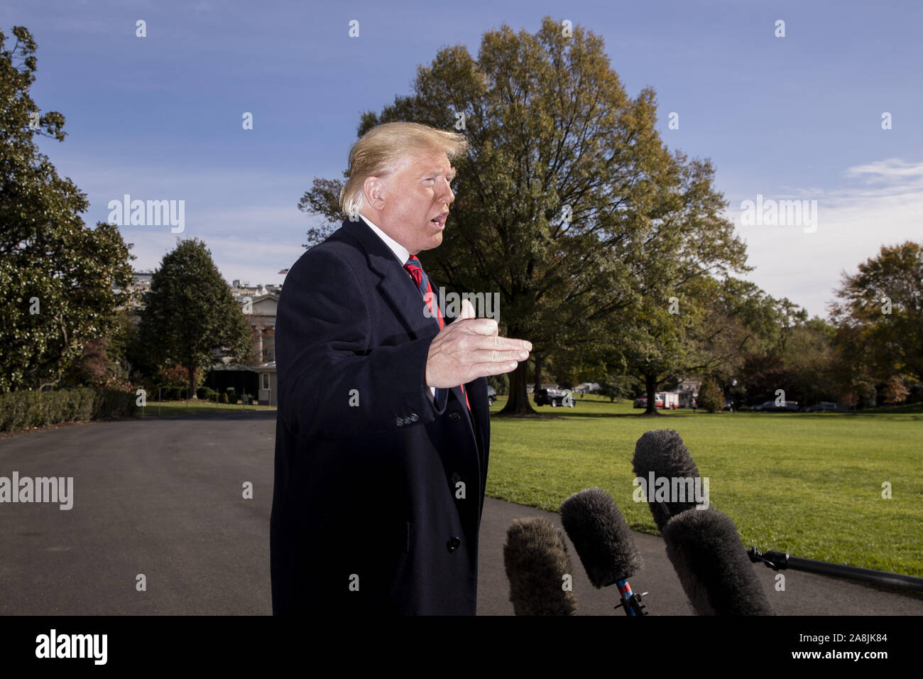Washington, USA. 9th Nov, 2019. President Donald Trump delivers brief remarks to members of the news media before departing with first lady Melania Trump (not pictured) on the South Lawn of the White House in Washington, DC, on Saturday, November 9, 2019. The president and first lady will attend a National Collegiate Athletic Association (NCAA) football game between Alabama and Louisiana State University in Tuscaloosa, Alabama, and then stay in New York City through Veterans Day. Photo by Michael Reynolds/UPI Credit: UPI/Alamy Live News Stock Photo