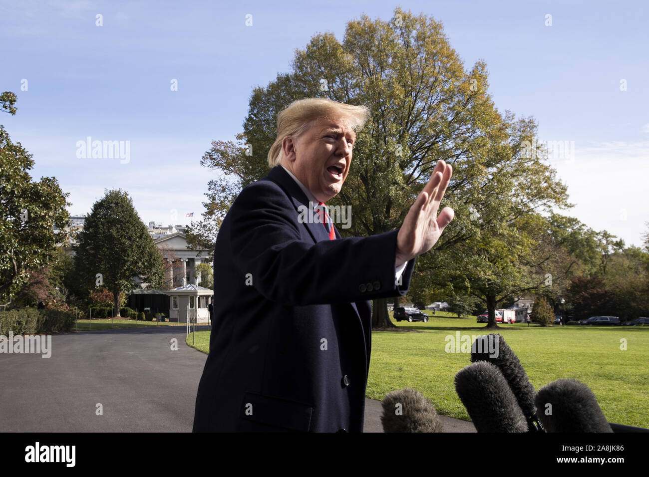 Washington, USA. 9th Nov, 2019. President Donald Trump delivers brief remarks to members of the news media before departing with first lady Melania Trump (not pictured) on the South Lawn of the White House in Washington, DC, on Saturday, November 9, 2019. The president and first lady will attend a National Collegiate Athletic Association (NCAA) football game between Alabama and Louisiana State University in Tuscaloosa, Alabama, and then stay in New York City through Veterans Day. Photo by Michael Reynolds/UPI Credit: UPI/Alamy Live News Stock Photo