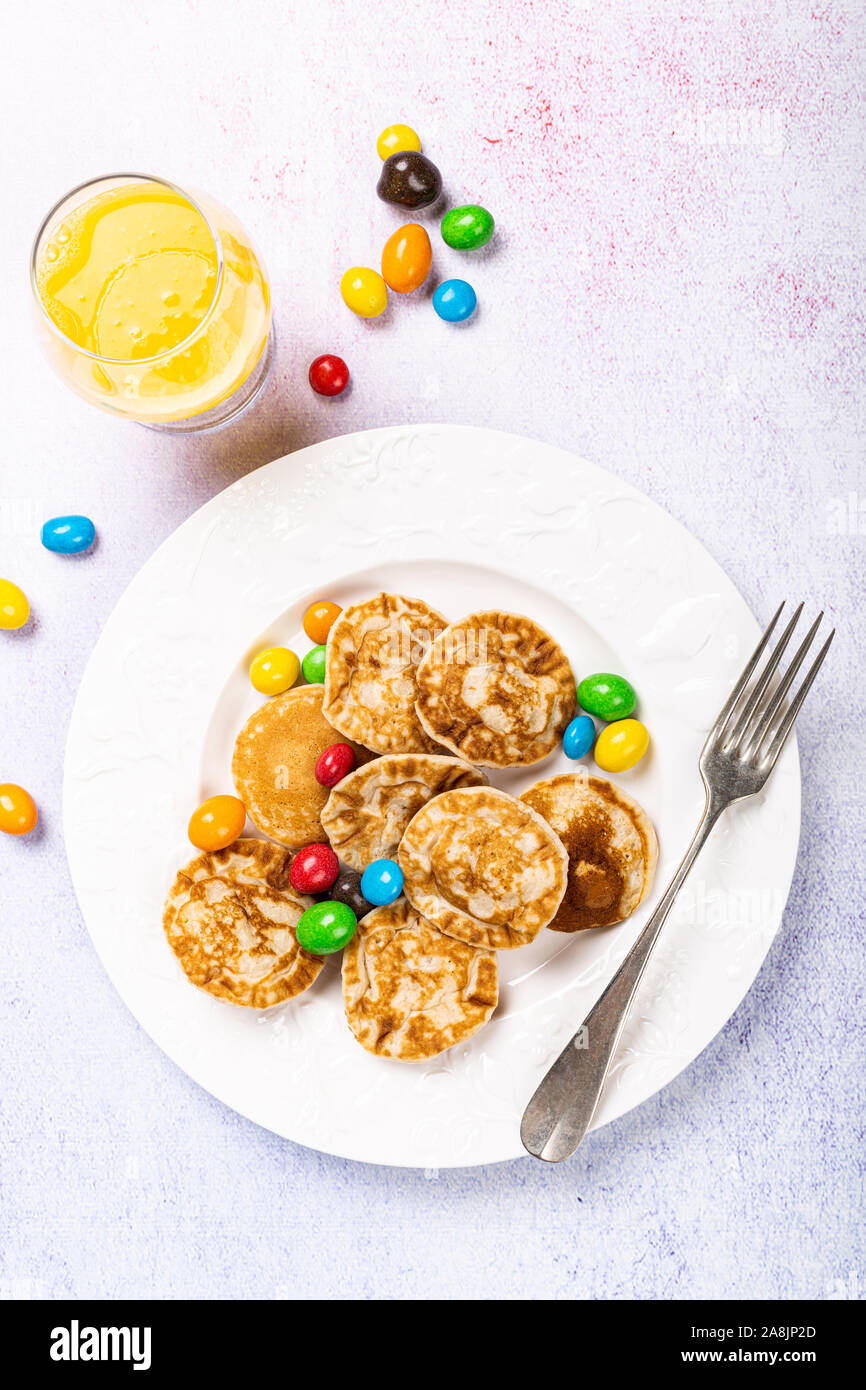 Dutch mini pancakes called poffertjes Stock Photo