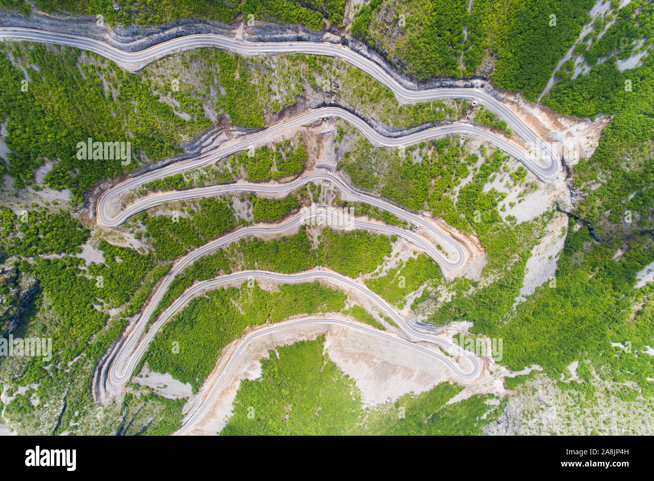 aerial view of Serpentine road in Albanian mountains near Rrapsh Stock